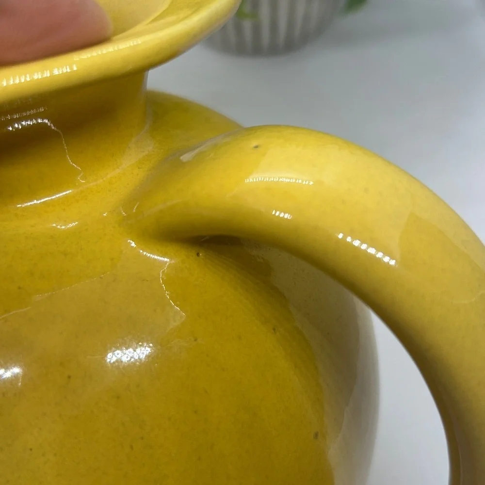 Frankoma Pottery Yellow MCM #82 Carafe dating back to the 1950s.